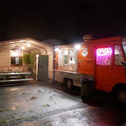 Carport with tables next to the truck so you can eat there even if it's raining!