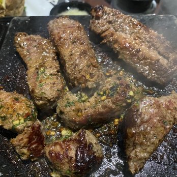 Black Rock Bar & Grill - Signature Black Rock Sirloin cooked in garlic butter - American Near Me - Novi, Michigan Black Rock Bar & Grill - Signature Black Rock Sirloin cooked in garlic butter - American Near Me - Novi, Michigan