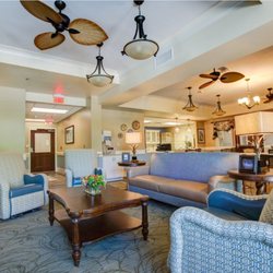 Davis Health & Wellness Ctr at Cambridge Village - The spacious living room with fireplace provides the perfect location for relaxation and socialization.