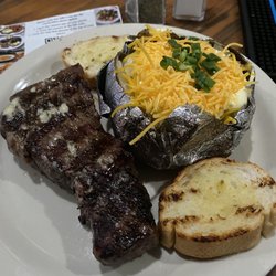 Brewster's - 12 oz. New York Strip and loaded baked potatoe , minus bacon bits