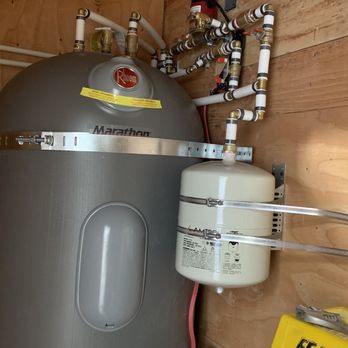Flow State Plumbing - High-efficiency Rheem Marathon water heater installed with precision PEX connections and pressure tank in a utility closet. - Plumbing Near Me - Talent, Oregon Flow State Plumbing - High-efficiency Rheem Marathon water heater installed with precision PEX connections and pressure tank in a utility closet. - Plumbing Near Me - Talent, Oregon