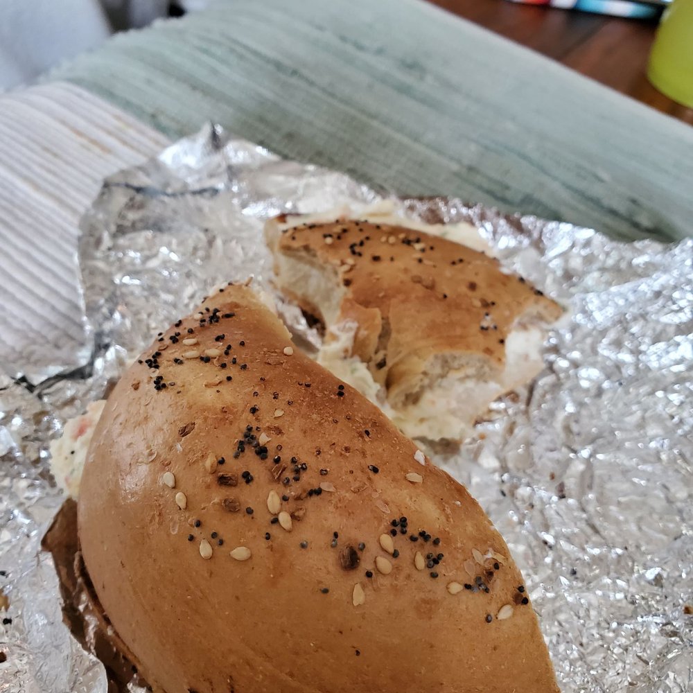 a close up of a bagel sandwich