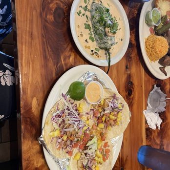 Guad's - Shrimp tacos with mango salsa and cabbage slaw... with a chipotle sauce. Absolutely delicious! - Mexican Near Me - Portsmouth, Virginia Guad's - Shrimp tacos with mango salsa and cabbage slaw... with a chipotle sauce. Absolutely delicious! - Mexican Near Me - Portsmouth, Virginia
