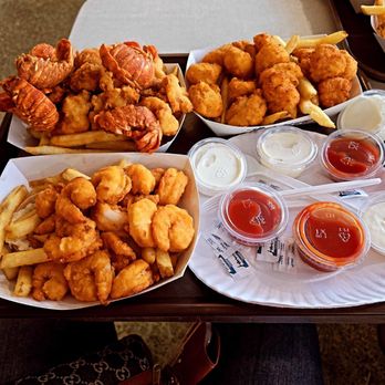 Johnny's Reef Restaurant - Here is the fried Lobster tails, fried shrimp,  and fried scallops, and they all come with French fries. - Seafood Near Me - Bronx, New York