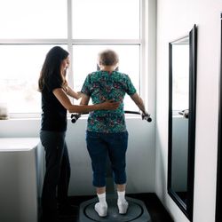 FIT Physical Therapy - Physical Therapist assisting patient in exercises.