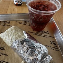 a burrito and a drink a burrito and a drink