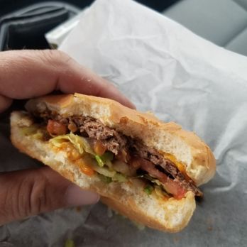 Big Burger -  person holding a sandwich in their hand - Burgers Near Me - Kansas City, Missouri