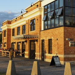 Wheelhouse Brewing Company - Wheelhouse Brewing waterfront building . Exterior . Golden hour.