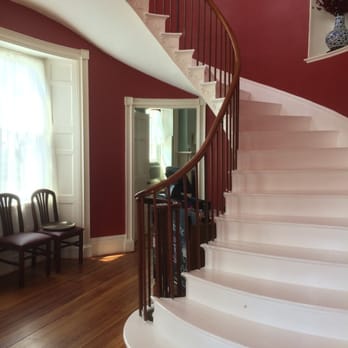 The Sumner House - Entry stair case. Leeds upstairs to the live music bar! - American Near Me - Charlestown, New Hampshire