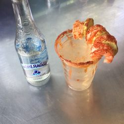 Mariscos Maggie - Sparkling water with cucumber, shrimp, lime and hot sauce