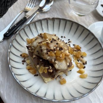 Café compagnon - Caramelized brioche w/ cream, poached pear and hazelnuts. Pears were the star of the dish - Cafes Near Me - Paris