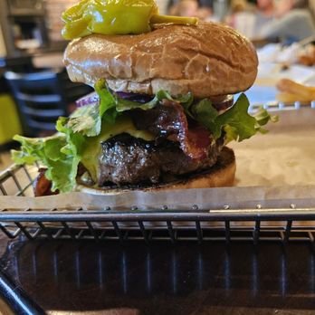 Hops Burger Bar - 6 oz Hops Classic with American cheese, bacon, Lettuce, tomatoes, pickles, onions, Ketchup, mustard, and mayo. - Burgers Near Me - Greensboro, North Carolina Hops Burger Bar - 6 oz Hops Classic with American cheese, bacon, Lettuce, tomatoes, pickles, onions, Ketchup, mustard, and mayo. - Burgers Near Me - Greensboro, North Carolina
