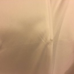 Pulled thread on the inside of my dress. Pulled thread on the inside of my dress.