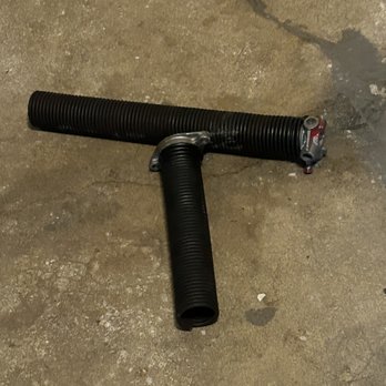 Green T Garage Doors - The broken spring. - Garage Door Services Near Me - Aurora, Illinois Green T Garage Doors - The broken spring. - Garage Door Services Near Me - Aurora, Illinois