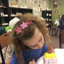Sunshine Arts & Crafts - Proud of her melted Popsicle creation