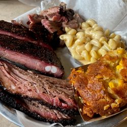 Platter with Brisket, Ribs, Pulled Pork, Smoke Mac N Cheese and Cornbread Casserole.