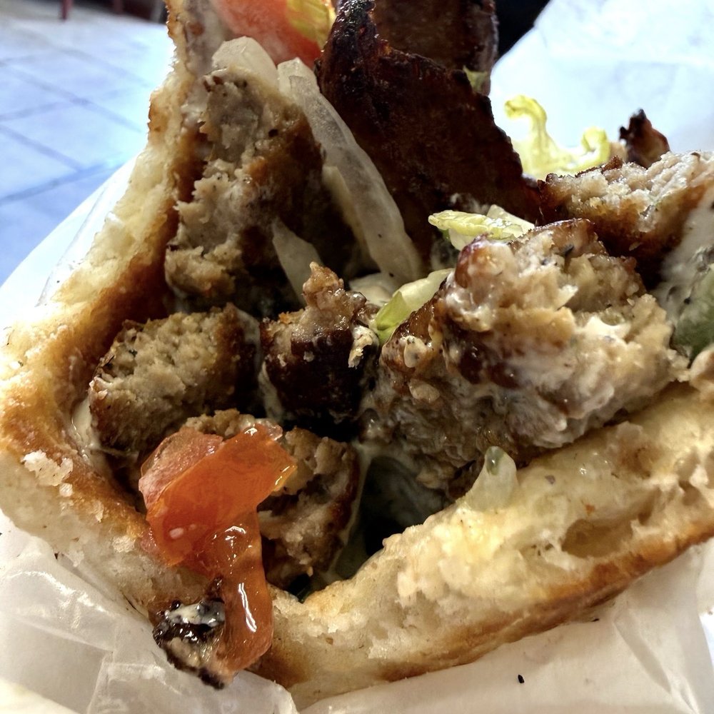 Khan Kitchen House - One bite in and you can see why this has become my favorite gyro. Every layer tastes as fresh as it looks. - Afghan Near Me - Brook Park, Ohio Khan Kitchen House - One bite in and you can see why this has become my favorite gyro. Every layer tastes as fresh as it looks. - Afghan Near Me - Brook Park, Ohio