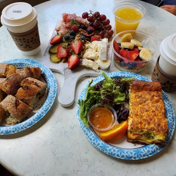 Café M - Fat Greek Yogurt, Fresh Fruit & Granola Parfait, gourmet board with French baguette, veggie quiche, Classic Mimosa, latte and au lait. - Cafes Near Me - Savannah, Georgia Café M - Fat Greek Yogurt, Fresh Fruit & Granola Parfait, gourmet board with French baguette, veggie quiche, Classic Mimosa, latte and au lait. - Cafes Near Me - Savannah, Georgia
