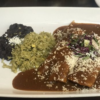 Hugo's Invitados - Brisket enchiladas with poblano corn rice and black beans - Seafood Near Me - Irving, Texas