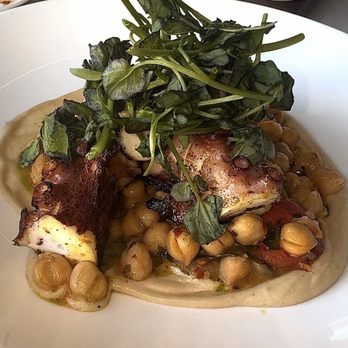 Spago - Mediterranean Octopus, Garbanzo Beans, Tahini, Roasted Tomatoes, Basil, Moroccan Chermoula - New American Near Me - Las Vegas, Nevada Spago - Mediterranean Octopus, Garbanzo Beans, Tahini, Roasted Tomatoes, Basil, Moroccan Chermoula - New American Near Me - Las Vegas, Nevada