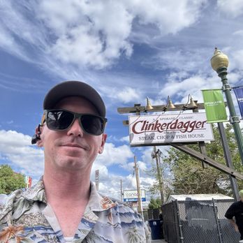 Clinkerdagger - Me with the sign to the place on the street front - Seafood Near Me - Spokane, Washington