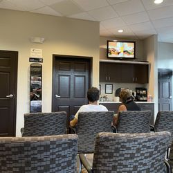 Florida Retina Institute - Main waiting room area with tv,water , and coffee service.