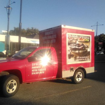 Broadway - a red truck parked in a parking lot - Pizza Near Me - Montreal, Quebec