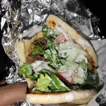 Halal Hub - Could not resist a bite before my pic. Sooo good! - Halal Near Me - Austin, Texas