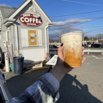 Longfellow's Coffee - a person holding a cup of coffee - Coffee & Tea Near Me - Kinnelon, New Jersey