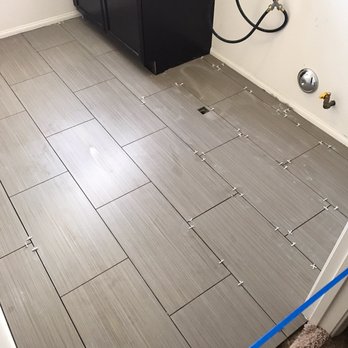 ADS Flooring Co - Laundry room floor before grouting - Flooring Near Me - Riverside, California