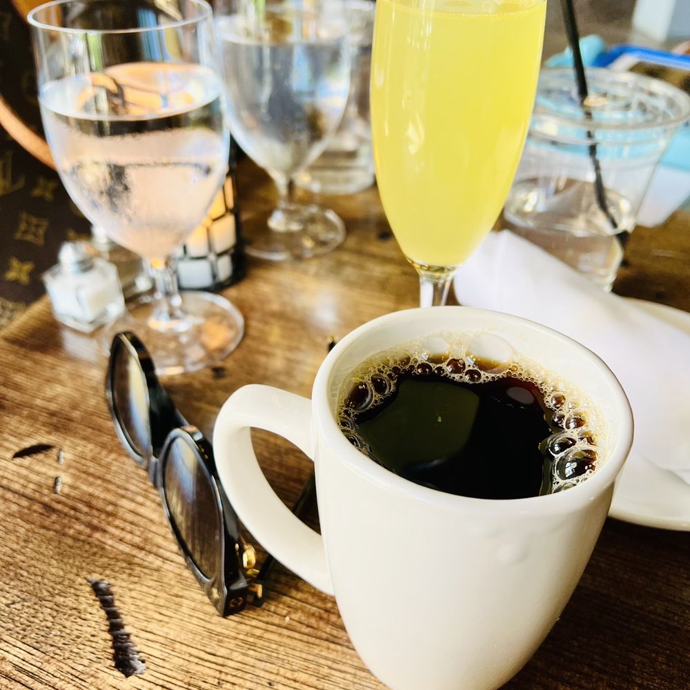 Epulo Bistro - a cup of coffee and glasses - Modern European Near Me - Edmonds, Washington Epulo Bistro - a cup of coffee and glasses - Modern European Near Me - Edmonds, Washington