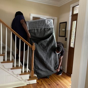Athletes Move U - How to get a huge desk over the banister and out the door? Very carefully! - Movers Near Me Athletes Move U - How to get a huge desk over the banister and out the door? Very carefully! - Movers Near Me