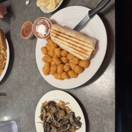 Breakfast burrito, Side of Tater Tots, banana Breakfast burrito, Side of Tater Tots, banana