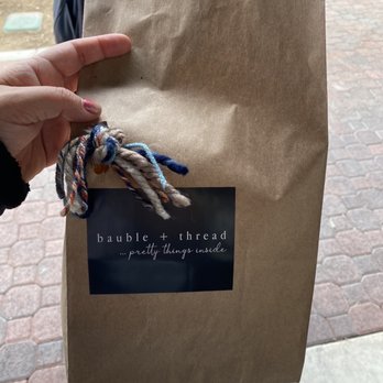 bauble + thread - Look at the cute bag. Simple. (They have the bigger brown bags with handles for bigger purchases. Which they add tissue to.) - Women's Clothing Near Me - Clovis, California