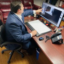 Richardson Podiatry Center - Dr. Haddad at his desk 2