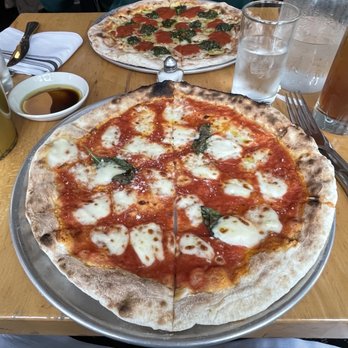 Fumo - Margherita Pizza (front), vegan pizza (back) - Italian Near Me - New York, New York Fumo - Margherita Pizza (front), vegan pizza (back) - Italian Near Me - New York, New York