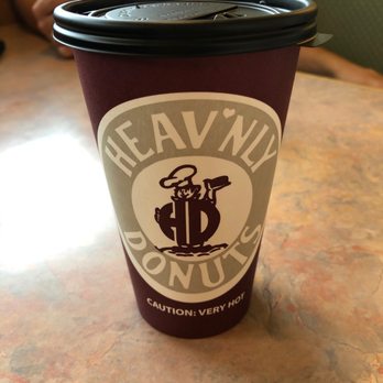 Heav'nly Donuts - a coffee cup on a table - Coffee & Tea Near Me - Derby, Connecticut Heav'nly Donuts - a coffee cup on a table - Coffee & Tea Near Me - Derby, Connecticut