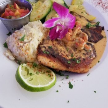 Spinners Rooftop Grille - Salmon with mash potatoes and mango pico de gallo - Lounges Near Me - St. Pete Beach, Florida