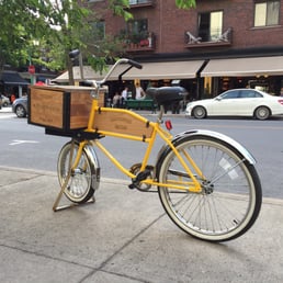 Cool delivery bike outside of the restaurant. Purely for decoration it appears. Cool delivery bike outside of the restaurant. Purely for decoration it appears.