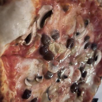 Sotto Sotto - a pizza with mushrooms and black olives - Italian Near Me - Oakville, Ontario Sotto Sotto - a pizza with mushrooms and black olives - Italian Near Me - Oakville, Ontario