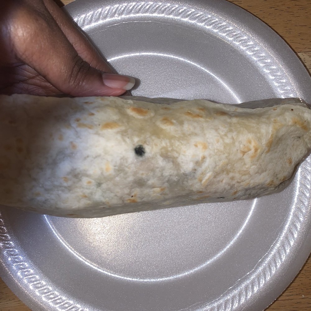 Tacos Arandas - a hand holding a burrito - Mexican Near Me - Los Angeles, California