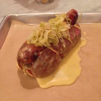 LowBrau - Bratwurst on pretzel roll with sauerkraut and cheese. - German Near Me - Sacramento, California LowBrau - Bratwurst on pretzel roll with sauerkraut and cheese. - German Near Me - Sacramento, California