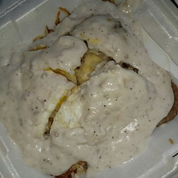 Merry Ann's Diner - The Diner Stack. A bed of hashbrowns with two eggs, sausage patties, a biscuit, smothered in gravy. - Diners Near Me - Champaign, Illinois