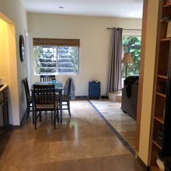 Hawiian Paradise Vacation Rental - Kitchen table. Kitchen in left. Full fridge on right.