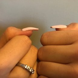 One on the left is what he did, and this after I tried filing it myself to fix the weird shape.