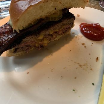 Au Cheval - Half of a double cheeseburger with bacon - Bars Near Me - Chicago, Illinois