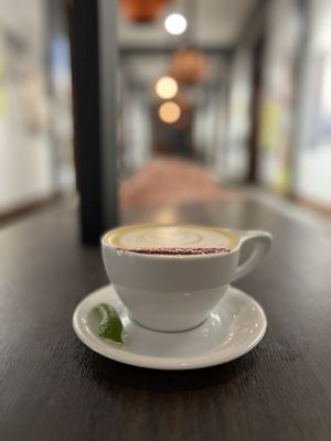 Photo of Coat Check Coffee - Indianapolis, IN, US. a cappuccino on a saucer