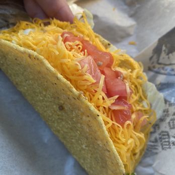 Del Taco - a hand reaching for a taco - Tex-Mex Near Me - Santee, California