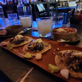 Lone Star Taco Bar - Carnita's tacos, a birria taco, and beans with rice. - Tacos Near Me - Cambridge, Massachusetts Lone Star Taco Bar - Carnita's tacos, a birria taco, and beans with rice. - Tacos Near Me - Cambridge, Massachusetts