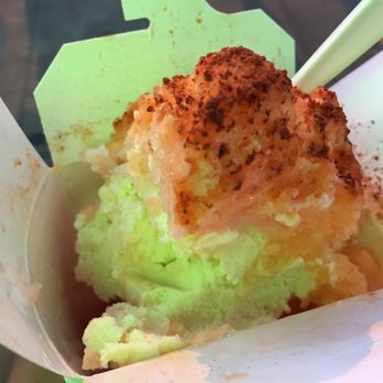 Vanilla ice cream with guava and passion fruit flavored shave ice, topped with condensed milk and li hing mui powder